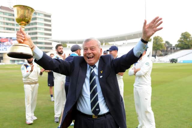 Yorkshire club president Dickie Bird with the County Championship trophy. Picture: Jonathan Gawthorpe.