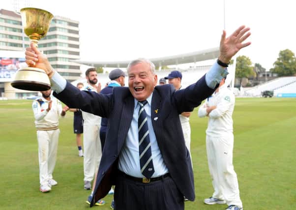 Yorkshire club president Dickie Bird with the County Championship trophy. Picture: Jonathan Gawthorpe.
