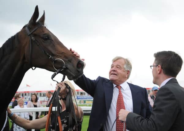 Trainer Sir Michael Stoute congratulates Estimate after winning at Doncaster.