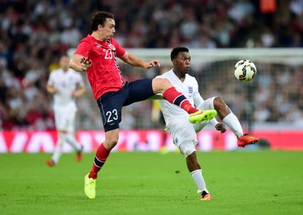 TURN OFF: England's Daniel Sturridge and Norway's Vegard Forren (left) battle for the ball during the recent Wembley friendly.