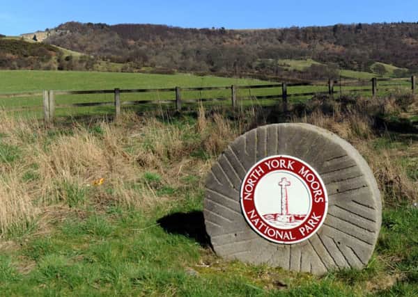 A North York Moors National Park sign at the foot of Sutton Bank