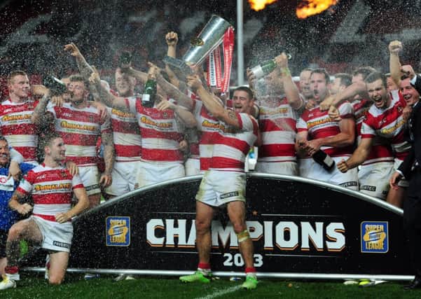 Wigan Warriors celebrate after winning the Super League Grand Final at Old Trafford last year.
