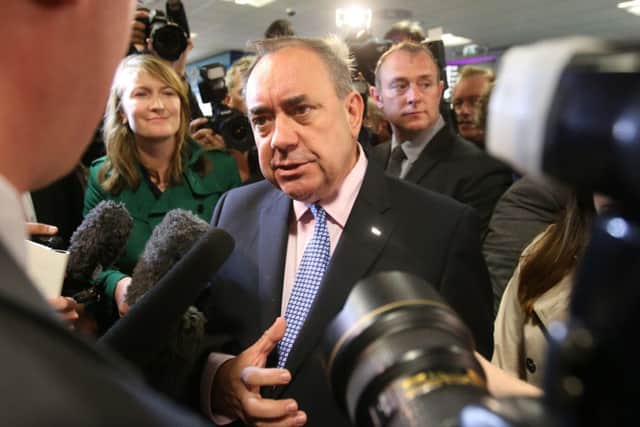 First Minister Alex Salmond speaks to the media after a photocall  with Business leaders at Edinburgh Airport