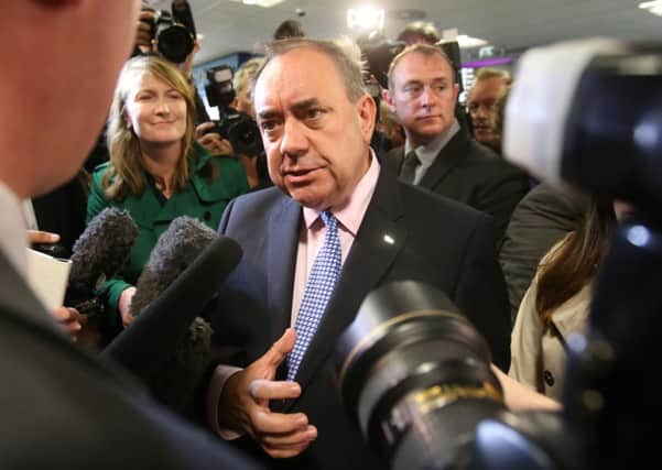 First Minister Alex Salmond speaks to the media after a photocall  with Business leaders at Edinburgh Airport