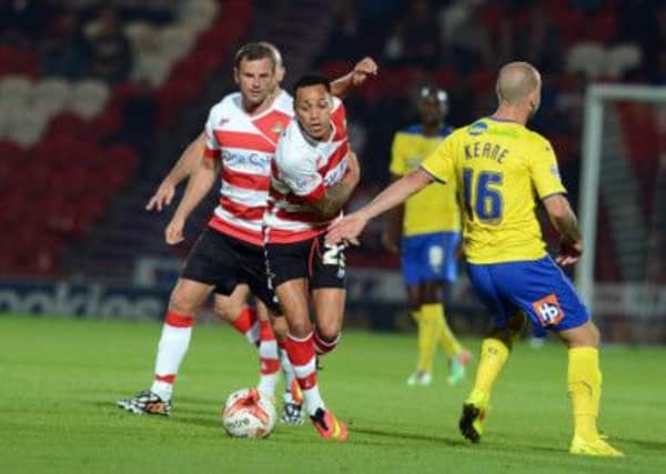 Doncaster Rovers' Kyle Bennett on the attack against Crawley Town.