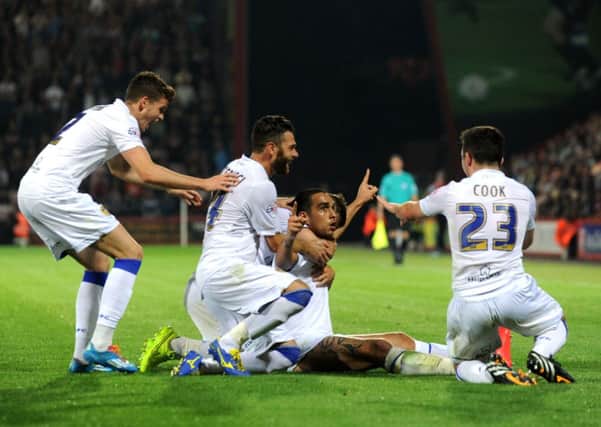 Giuseppe Bellusci celebrates with team-mates in front of the Leeds fans.