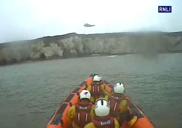 The RNLI responding after a helicopter crashed into the sea at Flamborough, killing two men.