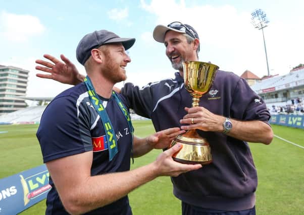 Yorkshire captain Andrew Gale and coach Jason Gillespie celebrate with the trophy.