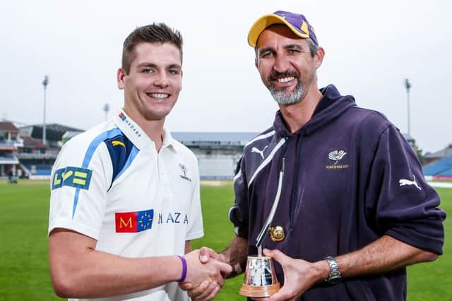 Yorkshire's Alex Lees is presented the 2014 LV= County Championship Breakthrough Player Award by his coach Jason Gillespie.