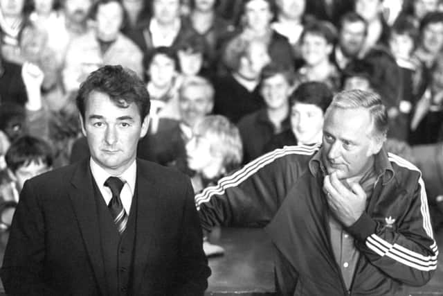 Brian Clough and assistant Peter Taylor sitting on the sidelines at Anfield.