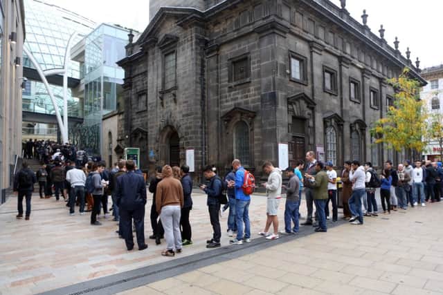 Fans queue round the block to get into the Apple Store in Leeds today. Picture: Ross Parry Agency