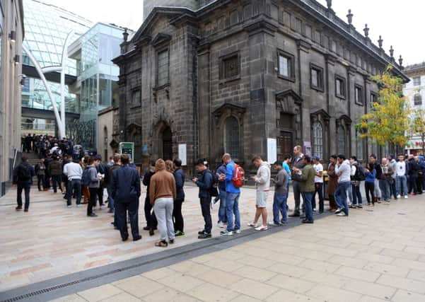 Fans queue round the block to get into the Apple Store in Leeds today. Picture: Ross Parry Agency