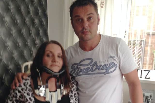 Joanna Rose in body brace with husband Andrew