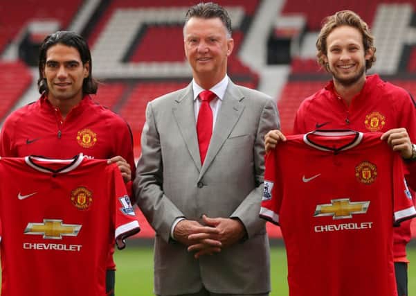 Manchester United manager Louis van Gaal with two of his new signings Radamel Falcao, left, and Daley Blind.