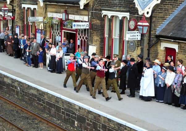 Students from The Skipton Academy  recreating the send-off on Settle Station