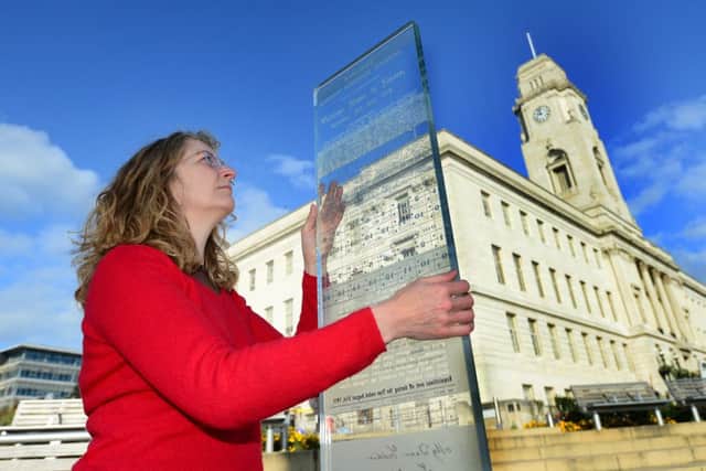 Artist Rachel Welford with one of the three glass panels that make up her artwork commemorating the Barnsley Pals