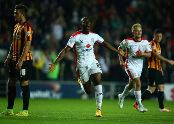 MK Dons' Benik Afobe scores his first goal against Bradford City. Picture: Getty Images.