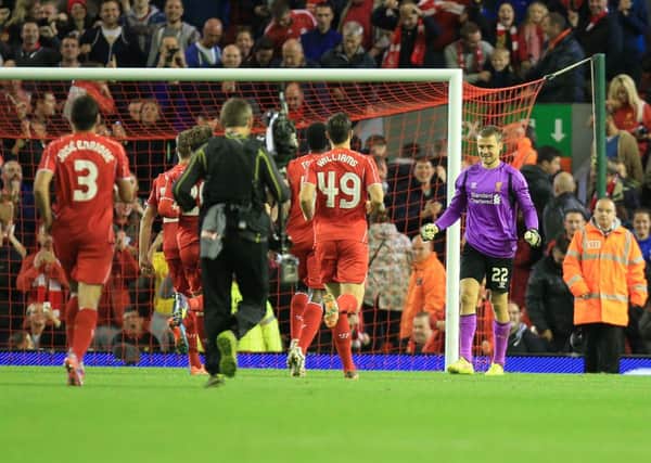 Liverpool's Simon Mignolet celebrates his side's dramatic win against Middlesbrough after a marathon 14-13 penalty shoot-out at Anfield.