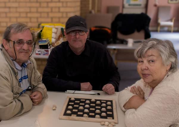 Holme Wood Visually Impaired Persons group has been awarded £6,000 by the Big Lottery Fund.

Chairman Paul Robinson, centre, enjoying adapted board games with members Danny Walker, left and Brenda Hamilton, right.