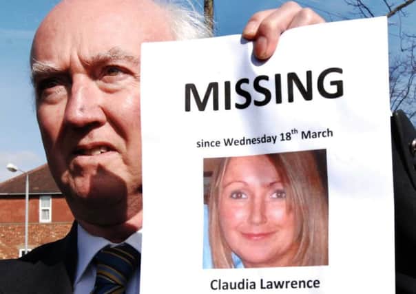 Peter Lawrence with a poster of missing Claudia