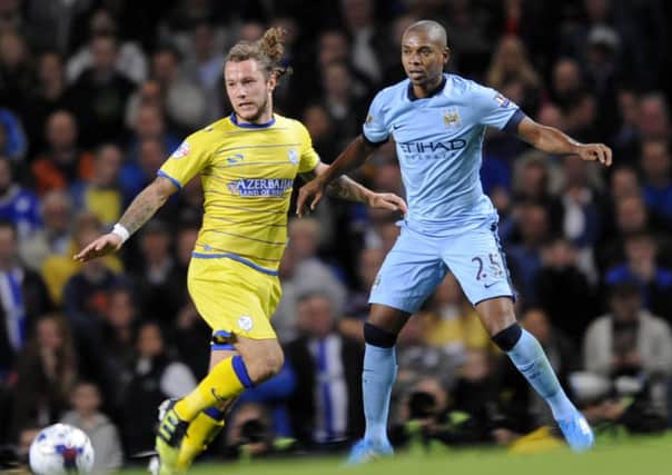 Owls' Stevie May challenges Manchester City's Fernandinho
