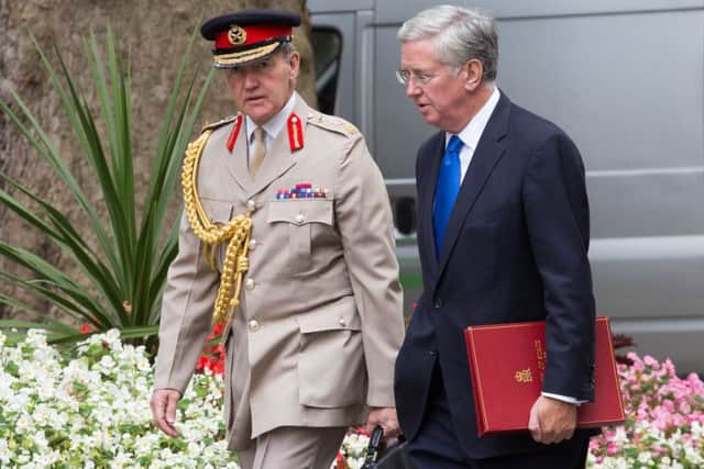 The Secretary of State for Defence, Michael Fallon (right) and Chief of the Defence Staff General, Sir Nicholas Houghton arrive for a cabinet meeting at 10 Downing St