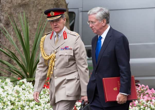 The Secretary of State for Defence, Michael Fallon (right) and Chief of the Defence Staff General, Sir Nicholas Houghton arrive for a cabinet meeting at 10 Downing St