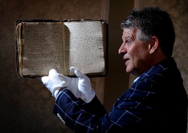 Auctioneer Gary Don with a rare diary found in a builder's yard in Chapel Allerton, Leeds.
