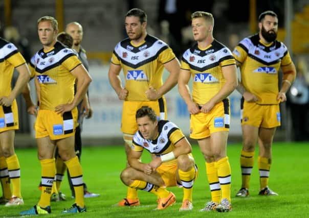 DOWN AND OUT: Castleford's players show their disappointment after play-off defeat to Warrington at Wheldon Road.  Picture: Jonathan Gawthorpe.