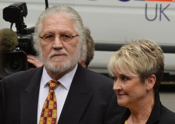Former Radio 1 DJ Dave Lee Travis arrives at Southwark Crown Court with his wife Marianne
