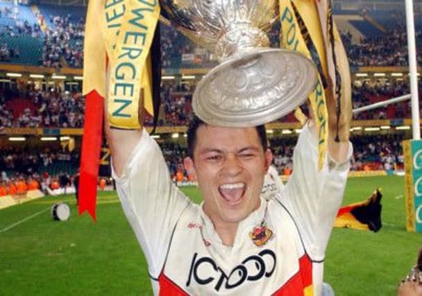 Bradford Bulls' Robbie Paul holds up the Challenge Cup after his side beat Leeds Rhinos 22-20 in the Powergen Challenge Cup final at the Millenium Stadium, Cardiff, in 2003.