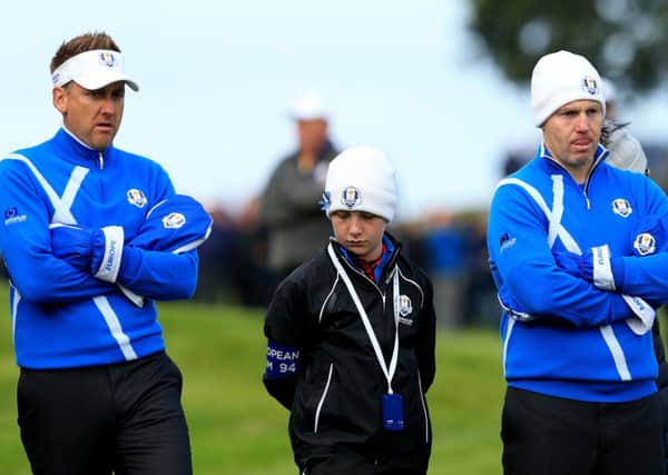 Europe's Ian Poulter, left, with Stephen Gallacher endured a miserable opening morning at Gleneagles.
