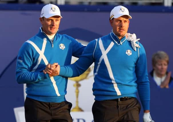 Europe's Henrik Stenson, right, and Justin Rose on the first tee during day one of the 40th Ryder Cup at Gleneagles.