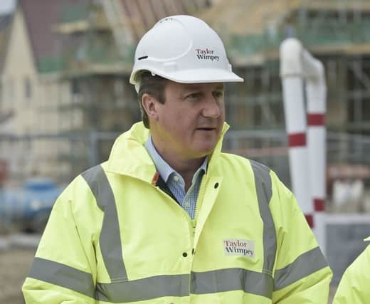 Cameron visiting a site Photo: PA