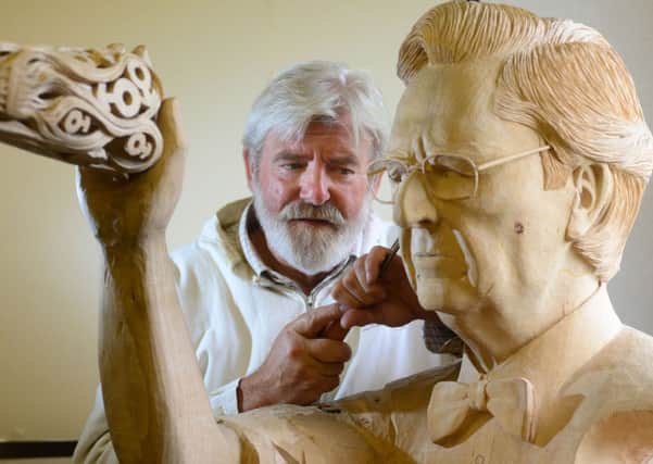 Sculptor OH Boyd used wood from HMS Victory to carve the crown for the new Diamond Jubilee state coach at his studio in Barton Upon Humber. Picture: Scott Merrylees