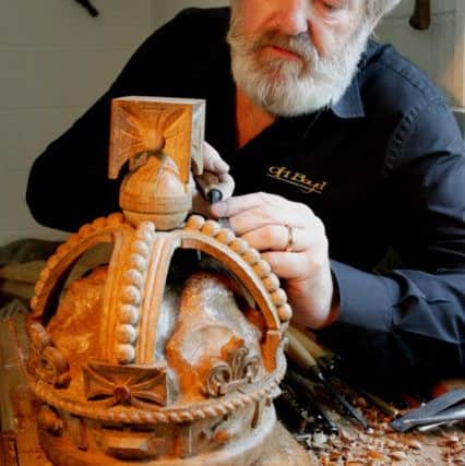 Sculptor OH Boyd used wood from HMS Victory to carve the crown for the new Diamond Jubilee state coach at his studio in Barton Upon Humber. Picture: Scott Merrylees