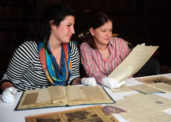 Lucy Moore, project coordinator, and Nicola Pullan, assistant curator, with some of her paperwork