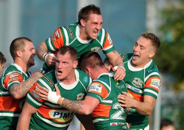 Hunslet's players celebrate Liam Hood's try. Picture: Jonathan Gawthorpe.