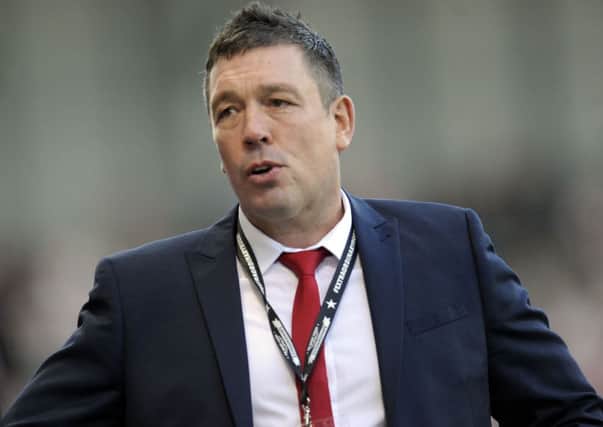 DOWN AND OUT: Sheffield Eagles coach Mark Aston watched his side lose out to Featherstone Rovers.