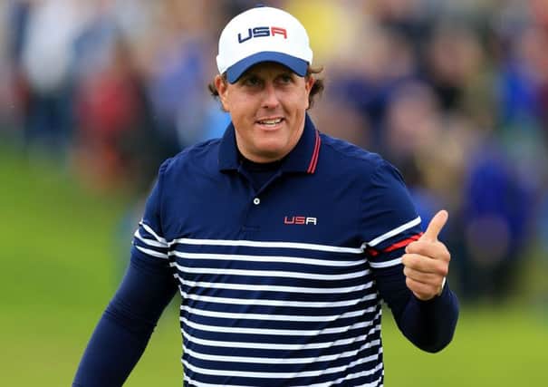 USA's Phil Mickelson gives a thumbs up on the eighth green