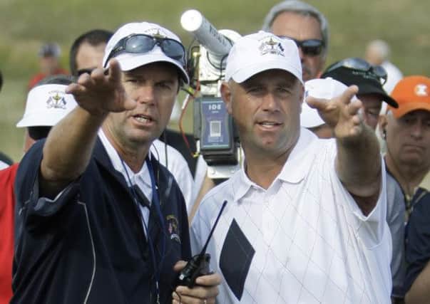 United States team captain Paul Azinger, left, discusses a shot with Stewart Cink at the Ryder Cup in 2008.