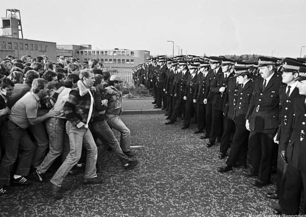A stand-off between miners and police. Picture: John Sturrock