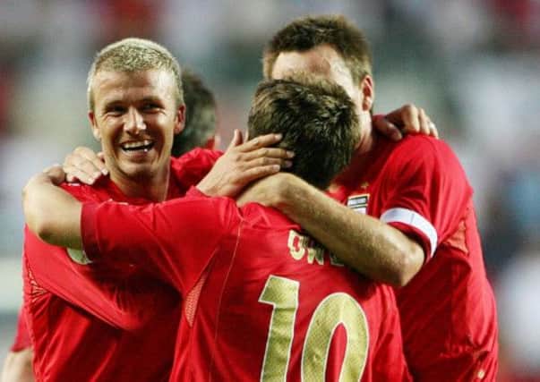 England's Michael Owen celebrates with David Beckham after scoring against Estonia during the Euro 2008 Qualifying Group E match at the A. Le Coq Arena, Tallinn, Estonia.