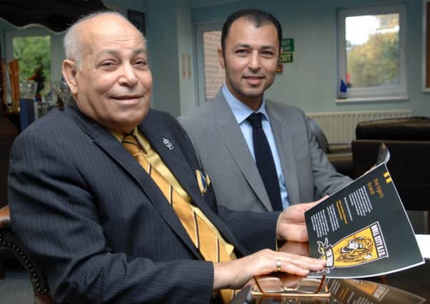 Hull City owner Assem Allam and his son, Ehab. Picture: Terry Carrott
