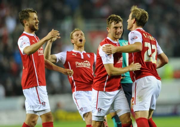 Luciano Becchio is congratulated by Rotherham United team-mates after scoring a fortuitous second goal for the Millers against Blackburn (Picture: Bruce Rollinson).