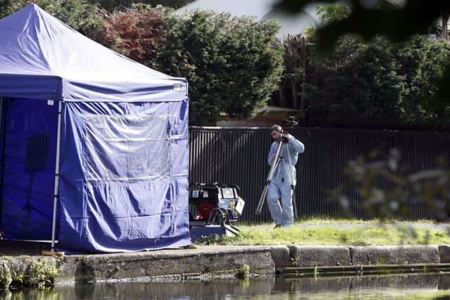 A police tent on the towpath by the River Brent in Hanwell, west London, after the Alice Gross investigation became a murder inquiry.