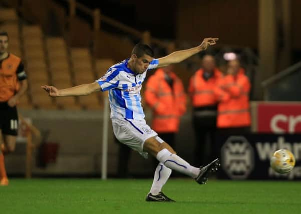 Huddersfield Towns Conor Coady scores his sides third goal in Wednesdays 3-1 victory away to Wolverhampton Wanderers (Picture: Nick Potts/AP).