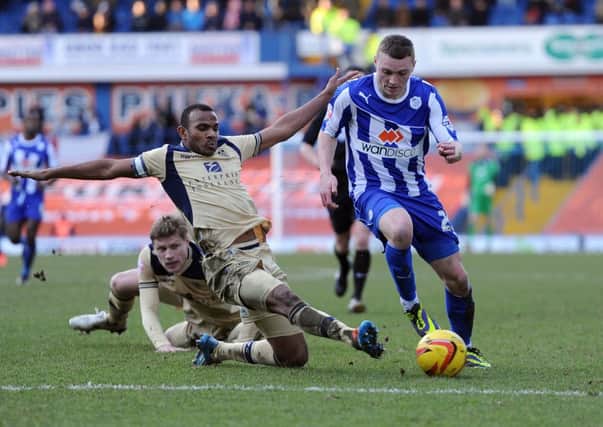 Sheffield Wednesday's Caolan Lavery is tackled by Leeds United's Rodolph Austin in last season's meeting between the two.