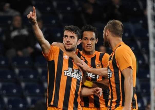 Hull City's Robbie Brady (left) celebrates with Thomas Ince (centre) and David Meyler (right)