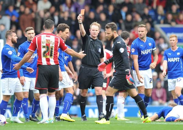 Sheffield United's Michael Higdon is given a red card.